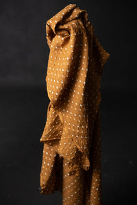 Bandhani tie-dye indian cotton fabric in bright ginger