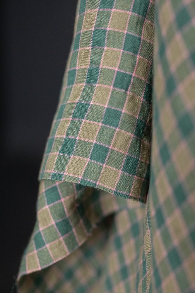 A green and pink laundered linen check fabric