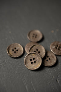 Unearthed Button