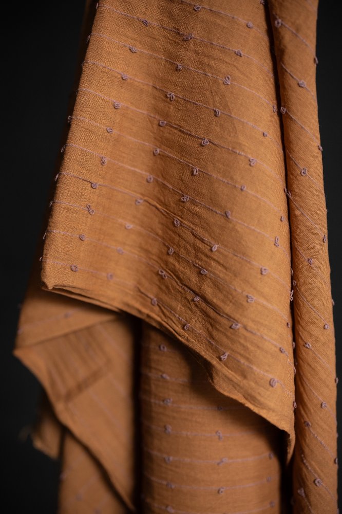 rusty orange loopy indian fabric 